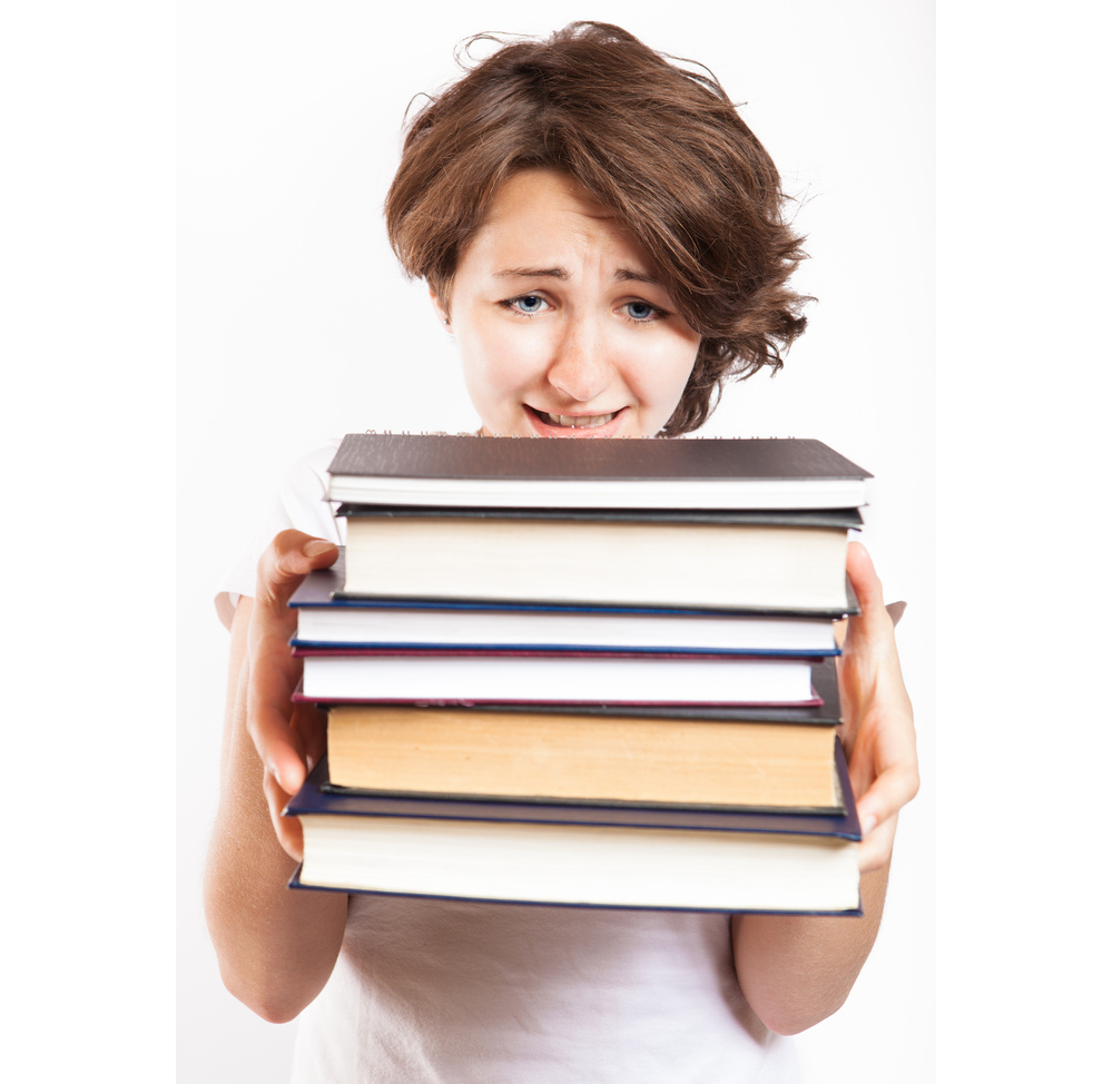 One day, everyone will perceive books with the same mixture of horror and confusion that this woman seems to be feeling. [Photo: CollegeDegrees360/flickr]