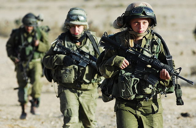 There's some women here. They're carrying guns and demanding long-overdue linguistic representation. We should probably listen to them. (Photo: Israel Defense Forces/wikimedia)